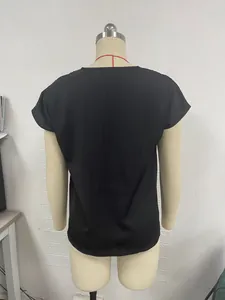 Detailed back view of a minimalist black batwing sleeve summer blouse shown on a dress form