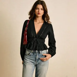 Elegant black deep V-neck blouse featuring a ruffle peplum hem and waist-cinching tie