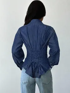 Detail view of a blue striped long sleeve shirt featuring a lace-up corset back design