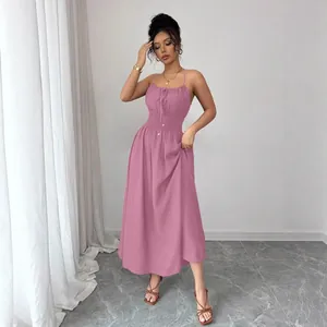 Elegant mauve spaghetti strap maxi dress with a smocked waist and a flowy silhouette.