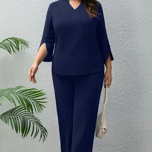 Elegant navy blue plus size two-piece leisure set featuring V-neck top and wide-leg trousers
