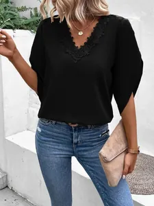 Chic black summer blouse featuring delicate lace flower V-neck and stylish split flare sleeves