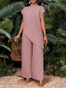 Conjunto de dos piezas para mujer con cuello alto, dobladillo asimmetrico y pantalón ancho