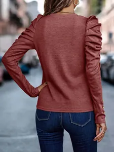 Back view of wine red slim fit top with elegant puff sleeves and cuff button details
