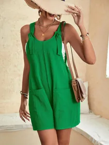 Combi-short d'été vert vif texturé avec bretelles nouées et poches avant pratiques