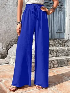 Detailed macro view of royal blue bubble grid textured wide leg casual summer pants