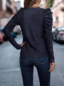 Back view of a slim fit long-sleeve top with elegant pleated puff shoulders in grey