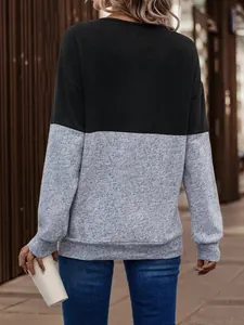 Rear view of women's color-block patchwork long sleeve casual top in black and grey