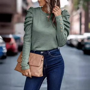 Elegant sage green slim fit puff sleeve top featuring decorative gold button details