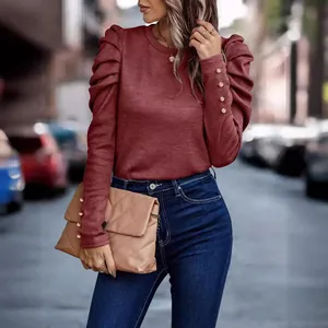 Elegant burgundy slim fit long sleeve top with pleated puff sleeves and gold cuff buttons