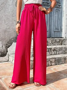 Detail view of vibrant pink bubble texture wide-leg casual pants with comfortable drawstring