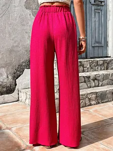 Detailed back view of magenta bubble textured high-waisted casual wide-leg pants for women