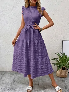 Detailed view of a purple textured midi dress with ruffle neck and flutter sleeves