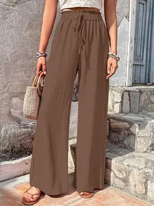 Stylish brown bubble gauze wide-leg pants with high elastic drawstring waist for summer.