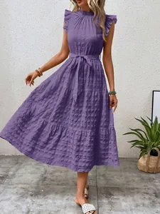 Full-length view showing the elegant texture and ruffle sleeve design of this purple dress.