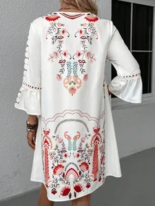 Detail of white boho floral print dress with elegant lace patchwork sleeve design