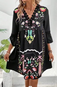 Bohemian black V-neck floral print dress with intricate lace trim and flared sleeves