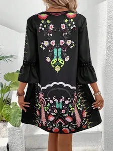 Back view of a black casual floral print dress with elegant lace sleeve detailing.