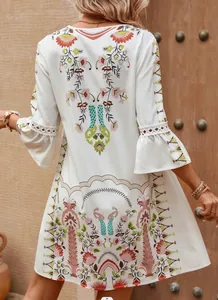 Back view of bohemian white floral print dress with bell sleeves and lace detail