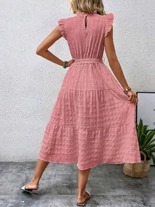 Back view of pink textured midi dress featuring ruffled butterfly sleeves and belted waist