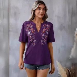 Elegant women's purple V-neck T-shirt featuring intricate floral embroidery and lace trim