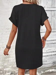 Elegant back view of a casual black summer t-shirt dress with trendy rolled sleeves