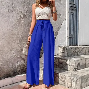 Royal blue casual wide-leg pants featuring textured bubble crepe fabric and drawstring