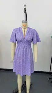 Detailed view of a purple floral summer dress with a V-neck and ruffled short sleeves