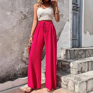 Fashionable fuchsia pink bubble grid textured wide-leg pants for women casual summer wear