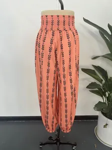 High-waist orange patterned lantern pants shown on a mannequin for casual summer style
