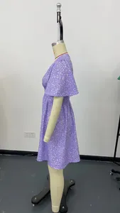 Side view of purple floral V-neck high waist pleated dress on a mannequin.