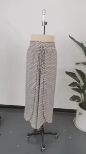 Full view of wide-leg skirt pants with side split and geometric pattern on mannequin