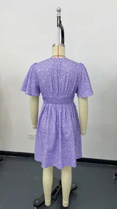 Rear view of a purple floral V-neck dress with smocked high waist and pleated skirt