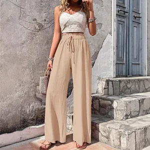 Chic beige seersucker wide leg pants with a comfortable elastic drawstring waist for summer