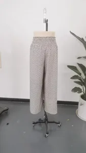 Detailed view of women's high-waisted patterned wide-leg culottes shown on a mannequin.