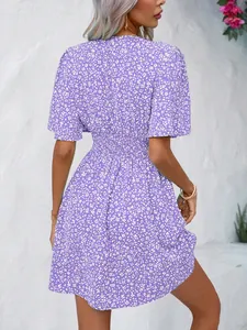 Detailed back view of a purple floral high waist smocked mini dress for women