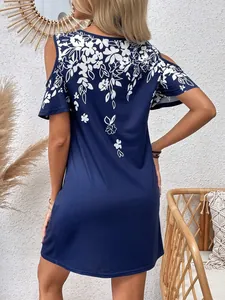 Detailed back view of a navy blue cold-shoulder dress featuring elegant white floral prints