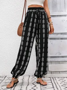 Bohemian black harem pants with white geometric print and elastic drawstring waist