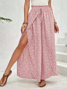 Close-up of pink floral wide-leg pants featuring a stylish high side slit detail