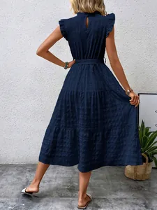 Elegant navy blue textured maxi dress with ruffled cap sleeves and back keyhole detail.