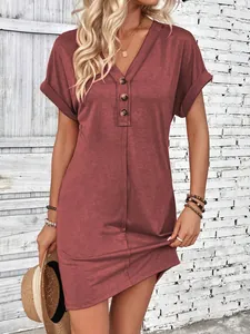 Elegant rust red V-neck summer dress featuring decorative buttons and stylish cuffed sleeves