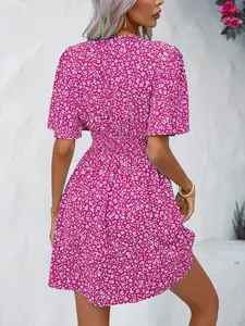 Back view of magenta floral summer dress with high elastic waist and short sleeves