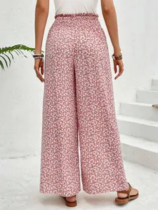 Detailed back view of trendy pink floral print wide-leg trousers for summer fashion