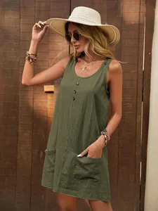 Detailed view of women's sleeveless cotton summer dress in olive green with pockets