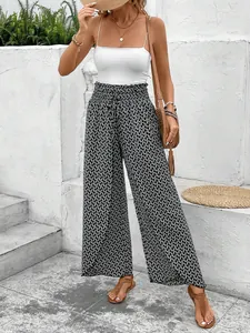 Summer high-waist wide-leg pants with geometric pattern and side slit shown on model