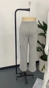 Grey wide-leg sweatpants with side cargo pockets shown on a showroom mannequin torso