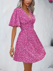 Boho style V-neck floral print dress with high waist and flutter sleeves for summer