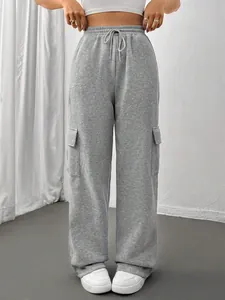 Detailed front view of gray wide-leg cargo sweatpants with side pockets and drawstrings