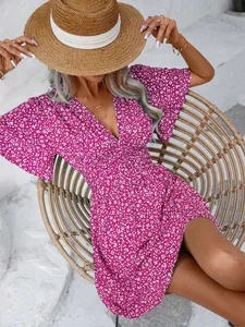 Detail view of purple floral V-neck dress with delicate white flower print and high waist