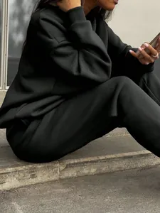 Detailed view of women's black soft cotton tracksuit set showing fabric texture and fit